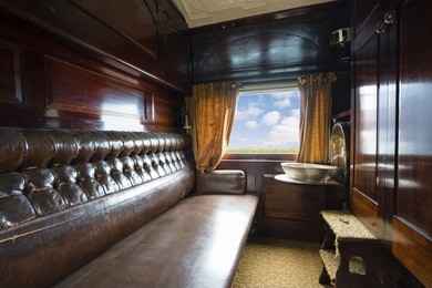 travelling inside a luxurious vintage train carriage, window view with motion blur