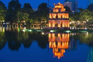 turtle tower, the symbol of vietnam, at twilight period at hoan kiem lake (ho guom or sword lake)