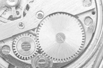 metal cogwheels inside clockwork. concept eternity, teamwork , idea technology. black and white macro photo.