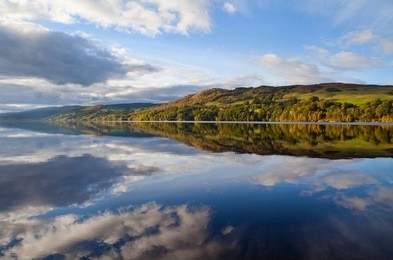 scottish loch in autumn scottish landscape at sunset
