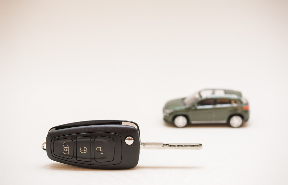 car key, small car, money.