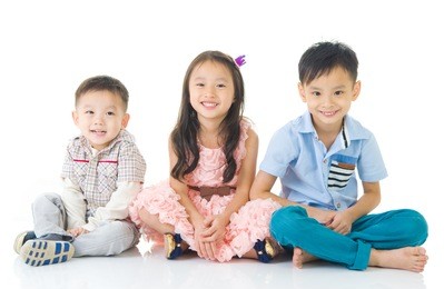 asian kids sitting on the floor
