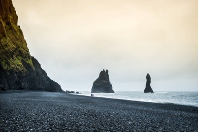 famous reynisdrangar rock formations at black reynisfjara beach. coast of the atlantic ocean near vik, southern iceland