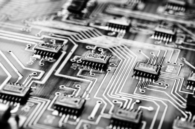 vintage printed circuit board in b/w with digital effects applied. shallow dof.