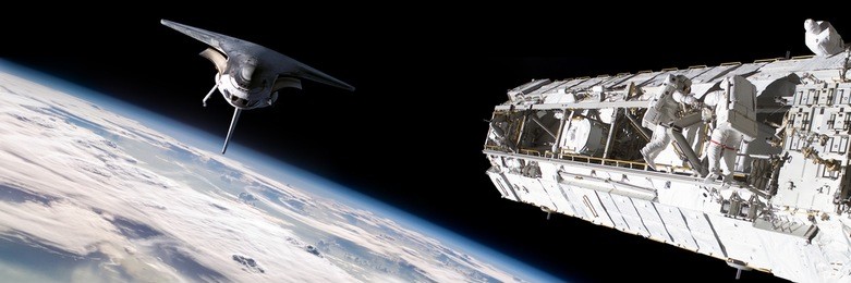 a team of astronauts performing work on a space station while the space shuttle slowly approaches to dock. - elements of this image furnished by nasa.