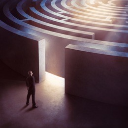 businessman at the entrance a circular maze
