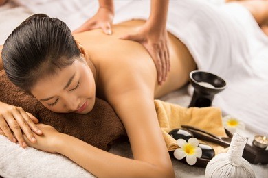 asian woman having massage and spa salon beauty treatment concept. she is very happy
