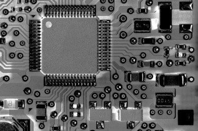 digitally altered printed circuit board black and white technology background. 