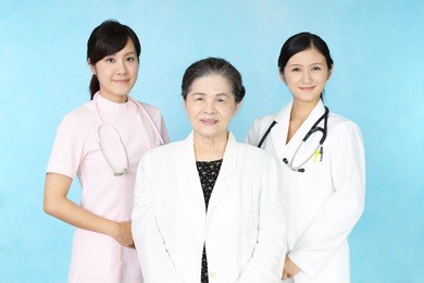 smiling medical stuff and an old lady