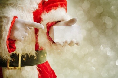 santa claus holding visit card