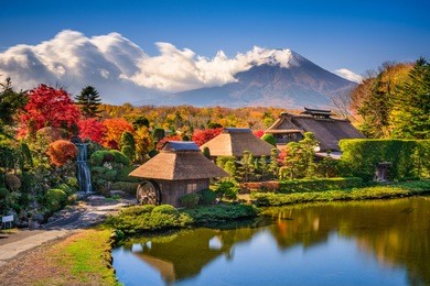 oshino, japan historic thatch roof farmhouses with mt. fuji.