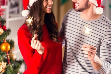 merry christmas. young couple celebrating christmas at home