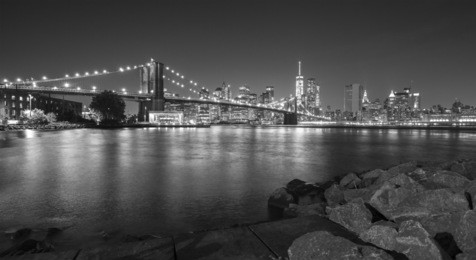 black and white photo of manhattan waterfront at night, new york city, usa.