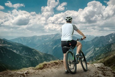 men with bicycle aroun mountains beautiful view.