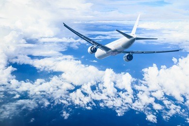 air plane flying against blue sky