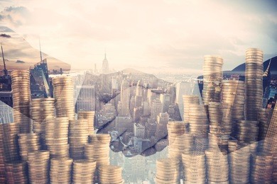 double exposure handshake with money coins pile and skyscrapers in the background. corporate background