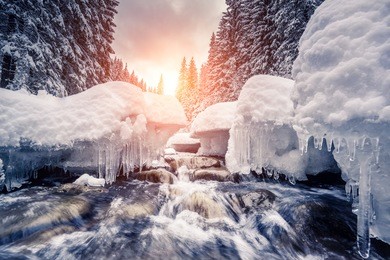 miracle river at sunlight in the morning. dramatic and picturesque wintry scene. location carpathian, ukraine, europe. beauty world. instagram toning effect. glowing filter.