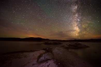 milky way as seen from the shores of the lake powell horizontal composition