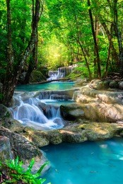 beautiful waterfall in thailand tropical forest