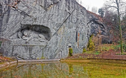 dying lion or lion of lucerne monument in lucerne, switzerland. it was carved out of natural rock in memory of the heroic deaths of the swiss mercenaries at the tuileries in 1792