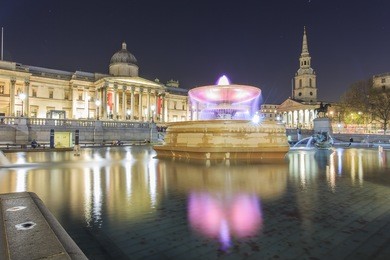 traveling in the famous trafalgar square, london, united kingdom around twilight