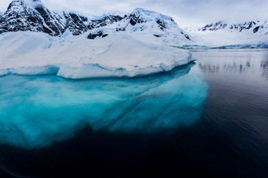 beautiful turquoise ice below surface glacier in antarctica