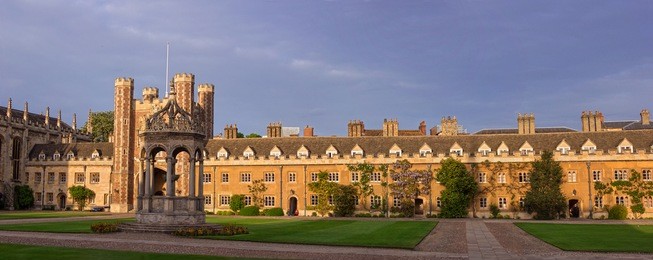 trinity fountain in a panorama of the great court of trinity college, cambridge, uk