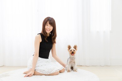 portrait of asian woman and dog in the room