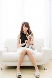 portrait of asian woman and dog in the room