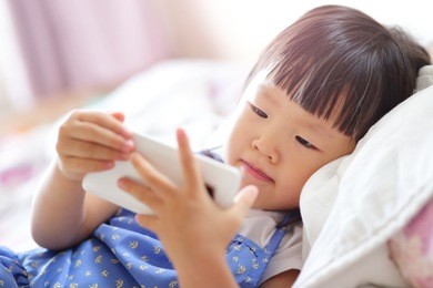 child girl happy look smart phone. asian child