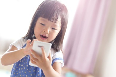 child girl happy look smart phone. asian child