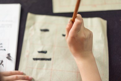 chinese children learn to write chinese characters, calligraphy is the traditional culture of china