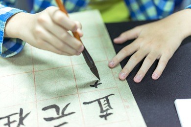 chinese children learn to write chinese characters, calligraphy is the traditional culture of china