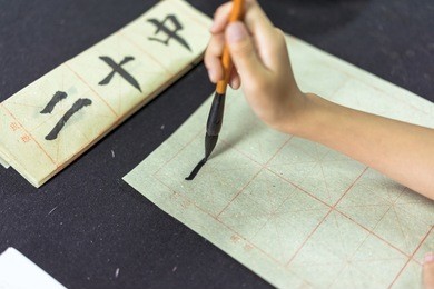 chinese children learn to write chinese characters, calligraphy is the traditional culture of china