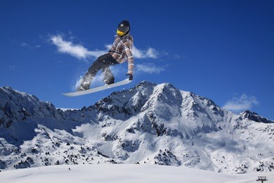 flying snowboarder on mountains. extreme winter sport.