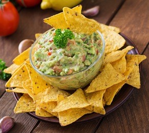 guacamole avocado, lime, tomato, onion and cilantro, served with nachos - traditional mexican snack