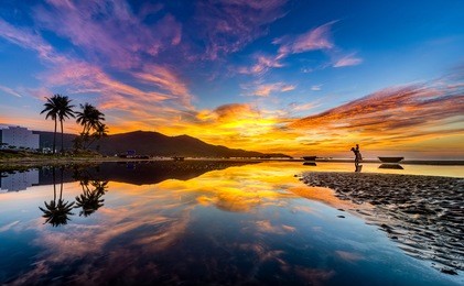 my khe beach is a beautiful beach in danang city ,  vietnam.  the sunrise was reflected in the pond bond before the beach. my khe beach is in  top 6 beautiful beach in the world by forbes magazine.  