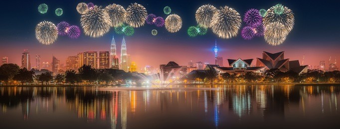 beautiful fireworks above cityscape of kuala lumpur skyline at night, malaysia