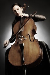 cello player cellist playing music instrument classical orchestra musician