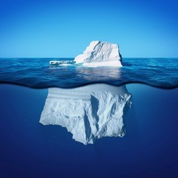 underwater view of iceberg with beautiful transparent sea on background