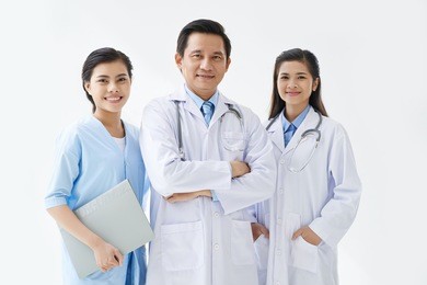 group of asian medical workers smiling at camera