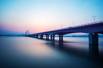 sunrise skyline and landscape of bridge over river