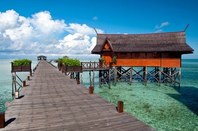a man-made walkway kapalai island with exotic tropical resort