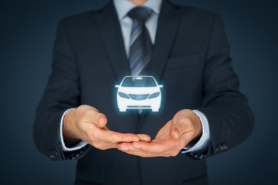 car (automobile) insurance and car services concept. businessman with offering gesture and icon of car.
