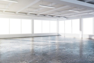 sunny spacious hangar area with concrete floor and windows in floor 3d render