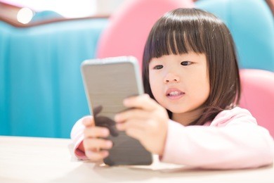 child girl happy look smart phone. asian child