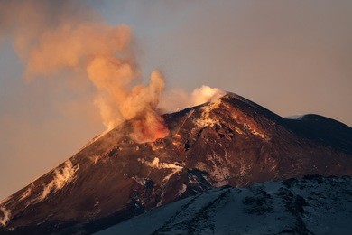 volcano eruption. mount etna erupting from the crater voragine
