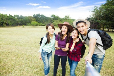top view of  happy young group making selfie by  smart phone