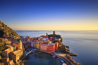 vernazza village, aerial view on red sunset, seascape in five lands, cinque terre national park, liguria italy europe. long exposure.