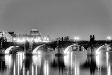 charles bridge and the center of prague on a night black and white hdr photo